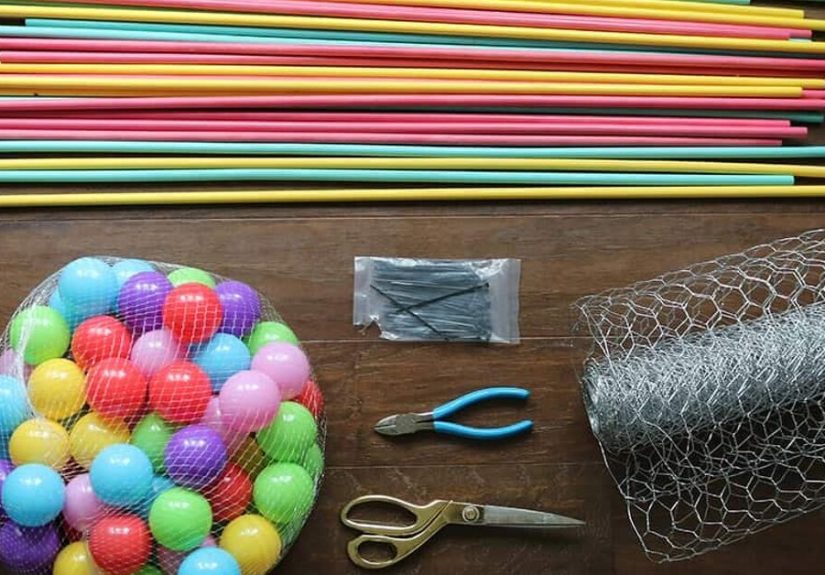 Use chicken wire and a bag of plastic balls for this amazingly fun summer idea